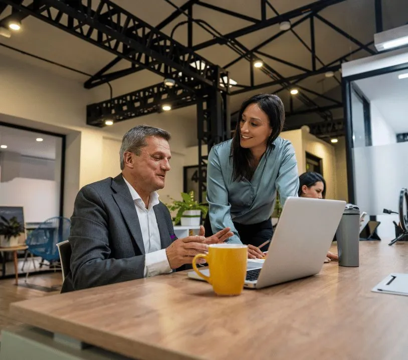A recruitment consultant in a meeting with a hiring team