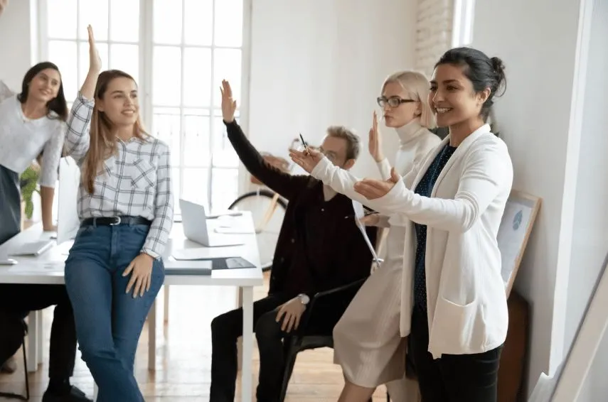 A team celebrating together in an office