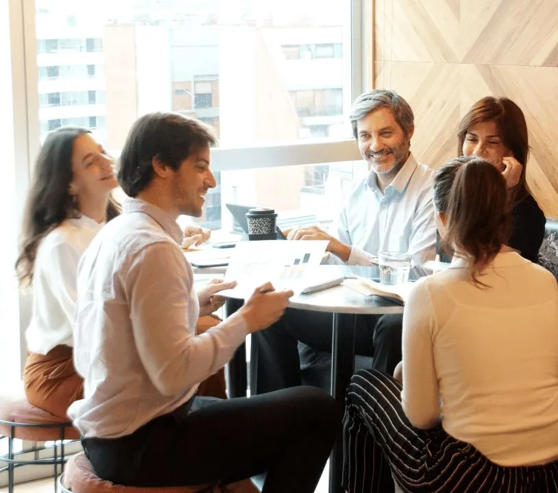 A team discussing plans around a table