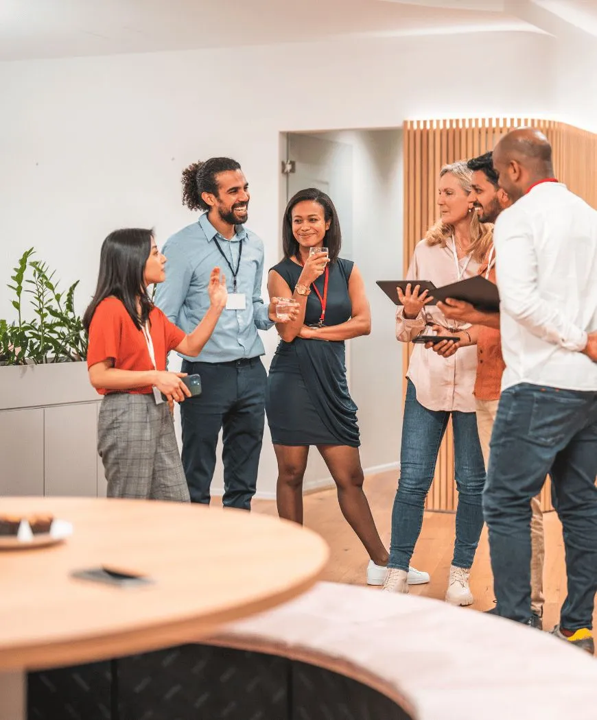 A team in a standing discussion in an office